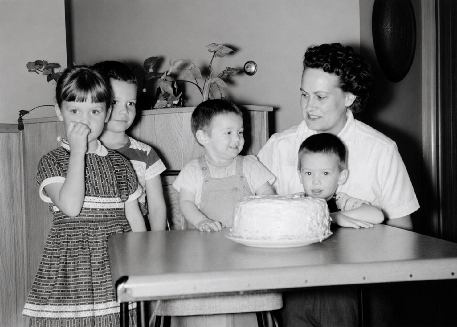 A family photograph featuring Barbara Tucker and her son on his first birthday.