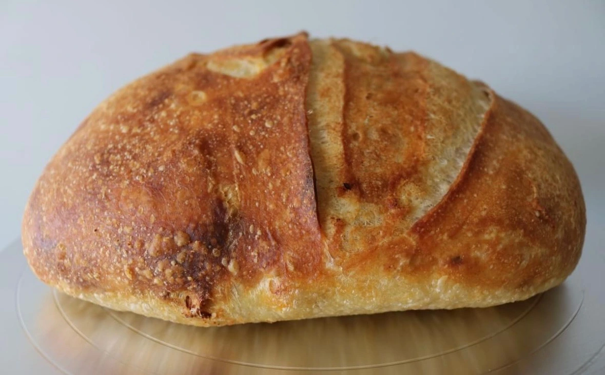 Garlic bread sourdough loaf side view